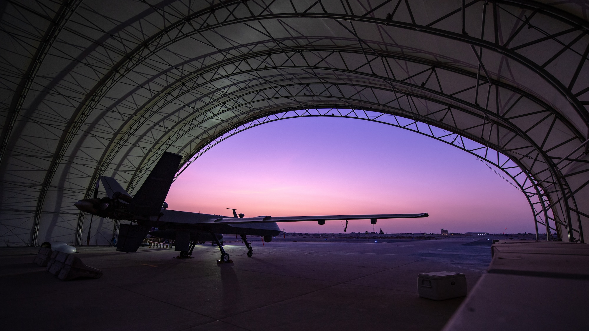 A U.S. Air Force MQ-9 Reaper remotely piloted aircraft awaits an engine test prior to Intelligence, Surveillance, and Reconnaissance operations at Ali Al Salem Air Base, Kuwait, July 23, 2019. Reaper’s are maintained, launched and recovered from deployed locations, but are remotely operated from bases in the United States during ISR operations around the world. (U.S. Air Force Photo by Tech. Sgt. Michael Mason)