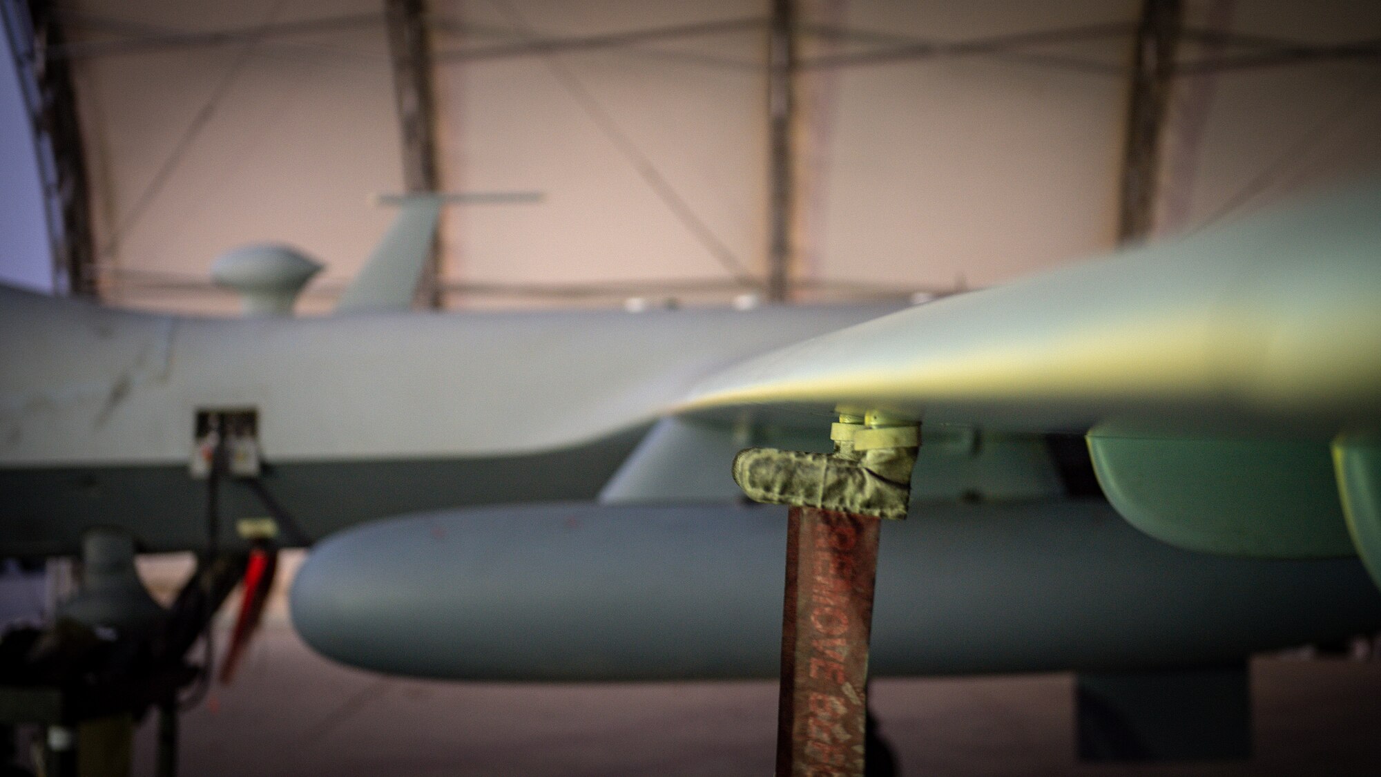 A U.S. Air Force MQ-9 Reaper remotely piloted aircraft awaits an engine test prior to Intelligence, Surveillance, and Reconnaissance operations at Ali Al Salem Air Base, Kuwait, July 23, 2019. Reaper’s are maintained, launched and recovered from deployed locations, but are remotely operated from bases in the United States during ISR operations around the world. (U.S. Air Force Photo by Tech. Sgt. Michael Mason)