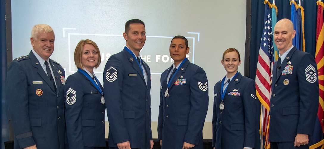 The Air National Guard Director, Lt. Gen. L. Scott Rice, Chief Master Sgt. Rachel L. Landegent, Master Sgt. Mark J. Jurakovich, Tech. Sgt. Andrew Merrylees, Airman 1st Class Kaleigh M. Bevan and ANG Command Chief, Chief Master Sgt. Ron C. Anderson pose for photo during the recognition ceremony of Focus on the Force held at the Air National Guard Readiness Center, 15 Aug. 2019  FOTF week is a five-day event emphasis on Air National Guard enlisted force growth and development through collaboration of leadership and subject matter experts including the ANG’s four Outstanding Airmen of the Year. (U.S. Air National Guard photo by Master Sgt. David J. Fenner)