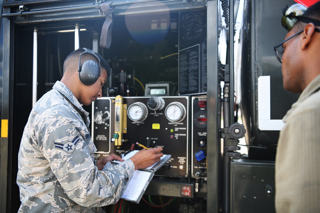 U.S. Air Force Airman 1st Class Christopher Flores-Rivera, 48th Logistics Readiness Squadron fuels distribution operator apprentice, logs his work on the flightline at Royal Air Force Lakenheath, England, Aug. 13, 2019. The Fuels Management Flight acquires, manages, distributes and maintains the fuel necessary to ensure aircraft from assigned to the 48th Fighter Wing are ready to fly. (U.S. Air Force photo by Airman 1st Class Shanice Williams-Jones)