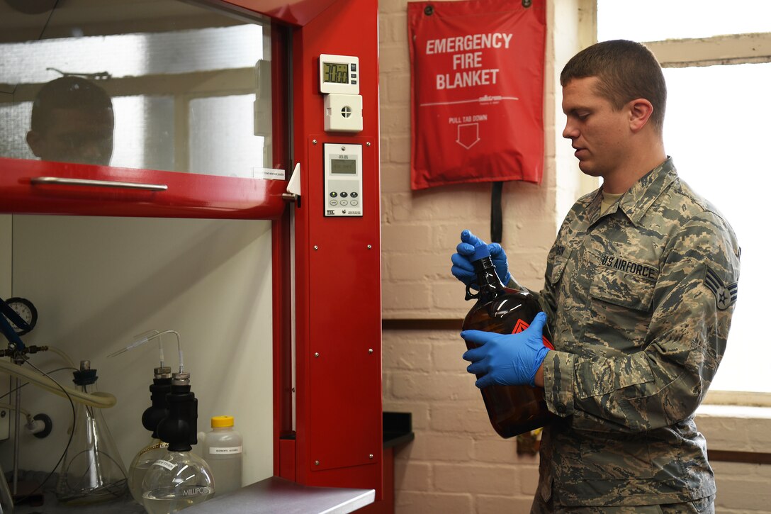 A 48th Logistics Readiness Squadron fuels apprentice, prepares his work space in the fuels laboratory at Royal Air Force Lakenheath, England, Aug. 13, 2019. The laboratory ensures the fuel is in excellent condition when it arrives, and facilitates the ability to appropriately monitor its quality for the safety of all facilities who utilize it. (U.S. Air Force photo by Airman 1st Class Shanice Williams-Jones)