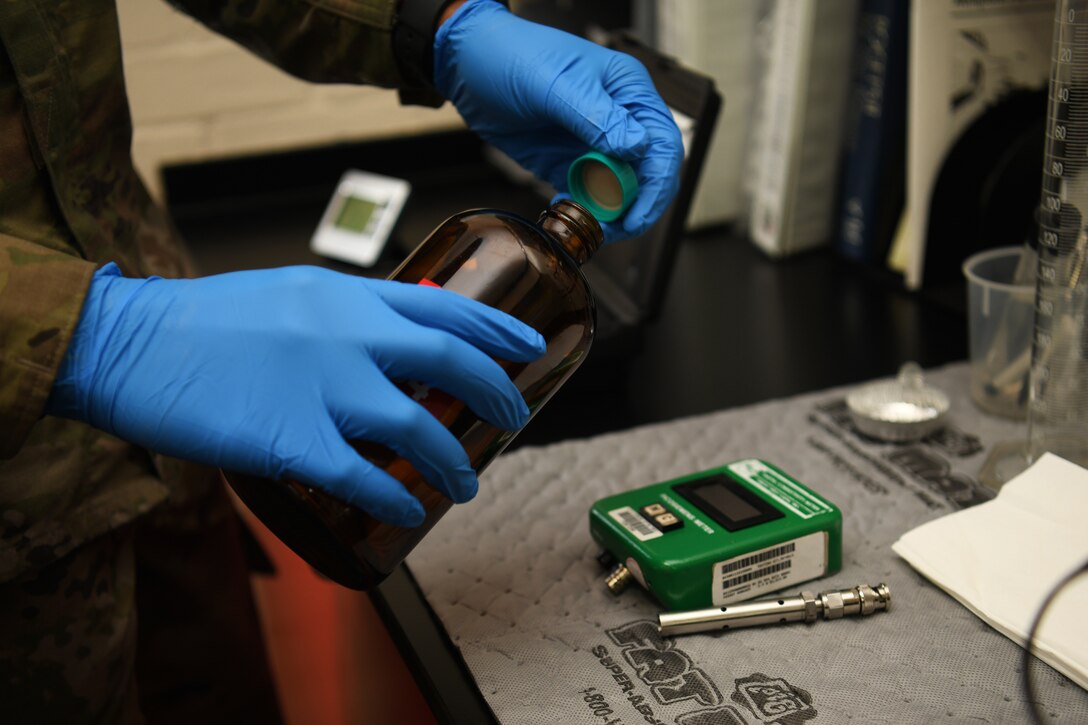 A 48th Logistics Readiness Squadron fuels apprentice, prepares his work space in the fuels laboratory at Royal Air Force Lakenheath, England, Aug. 13, 2019. The laboratory ensures the fuel is in excellent condition when it arrives, and facilitates the ability to appropriately monitor its quality for the safety of all facilities who utilize it. (U.S. Air Force photo by Airman 1st Class Shanice Williams-Jones)