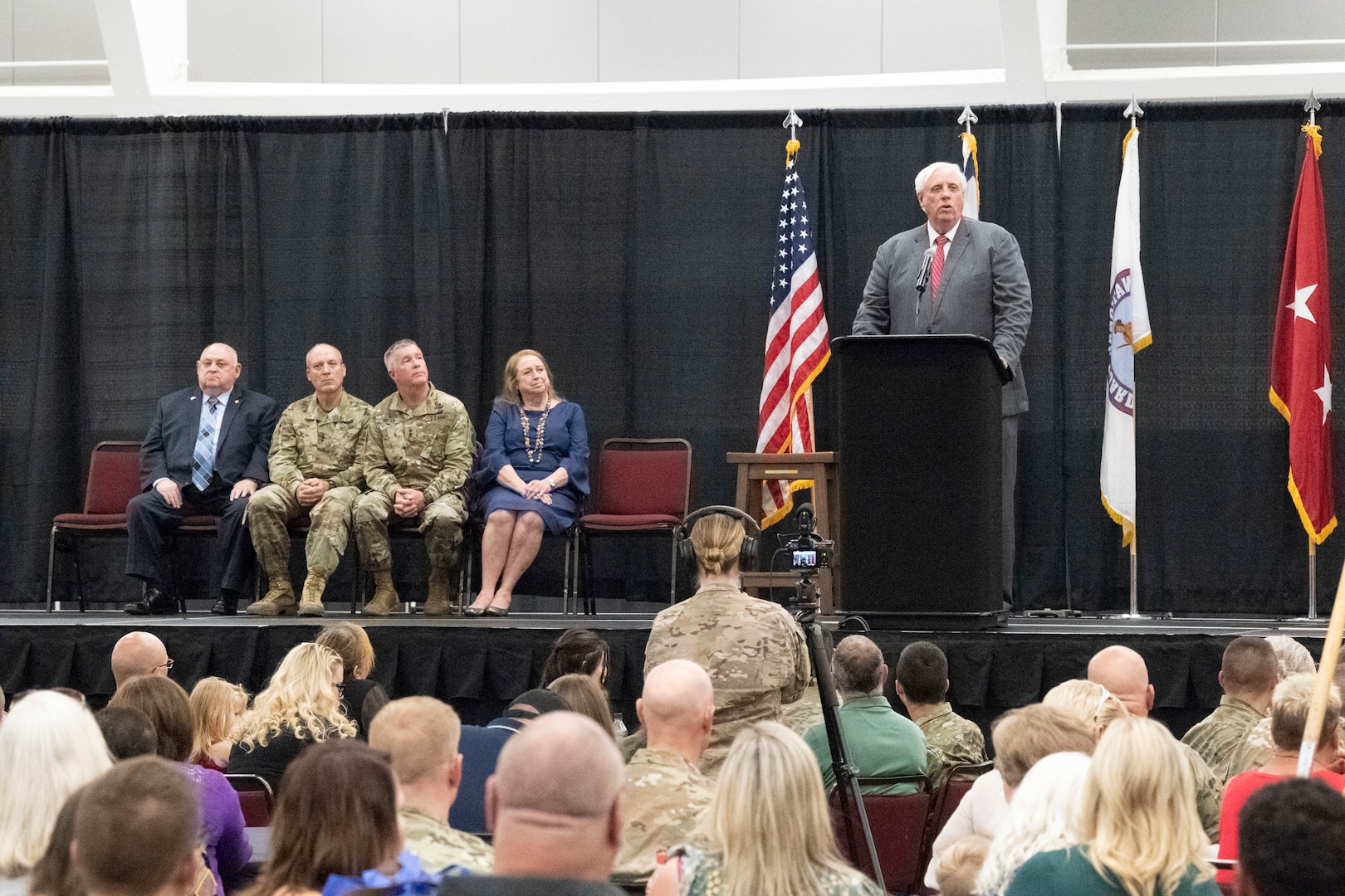 Gov. Jim Justice speaks to a crowd of Soldiers and families of the 1st Squadron, 150th Cavalry Regiment during a yellow ribbon deployment event held Aug. 16, 2019, at the Charleston Coliseum and Convention Center in Charleston, W.Va. More than 500 Soldiers of the 1st Squadron, 150th Cavalry Regiment; 1st Battalion, 201st Field Artillery Regiment; and D. Company, 230 Brigade Support Battalion, will join the North Carolina National Guard’s 30th Armored Brigade Combat Team (ABCT) for a deployment to the Middle East in support of Operation Spartan Shield in the coming months. (U.S. Army National Guard photo by Bo Wriston)