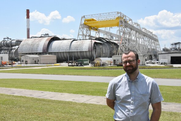 Instrumentation, Data and Controls Engineer Robert Duff takes a break from his new job at Arnold Air Force Base for a photo. Duff overcame homelessness while in college before eventually landing his job at Arnold. (U.S. Air Force photo by Brad Hicks) (This image was altered by obscuring building numbers for security purposes.)