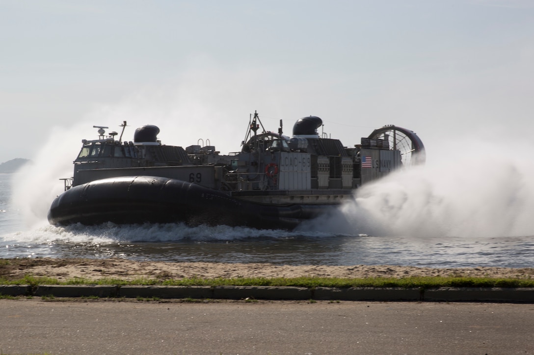 A U.S. Navy amphibious craft lands ashore.