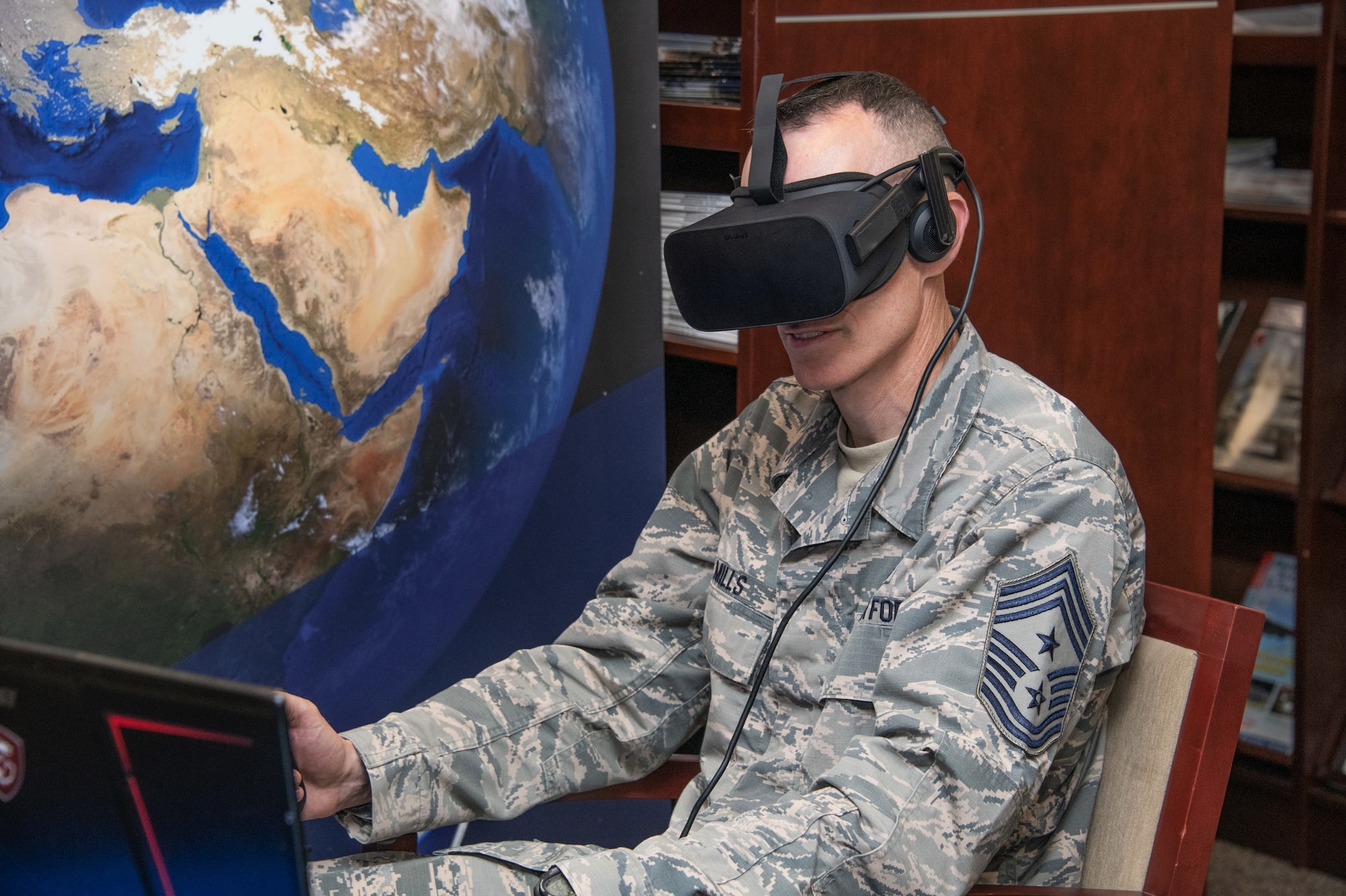 Chief Master Sgt. Lee Mills, 673rd Air Base Wing command chief from Joint Base Elmendorf-Richardson, Alaska, tests out virtual reality Aug. 13, 2019, during the Air University wing commander’s orientation on Maxwell Air Force Base, Alabama. Just one of the many projects the attendees had the opportunity to learn about was Air University’s application of virtual and mixed-reality as a means of enhancing the training of Airmen.