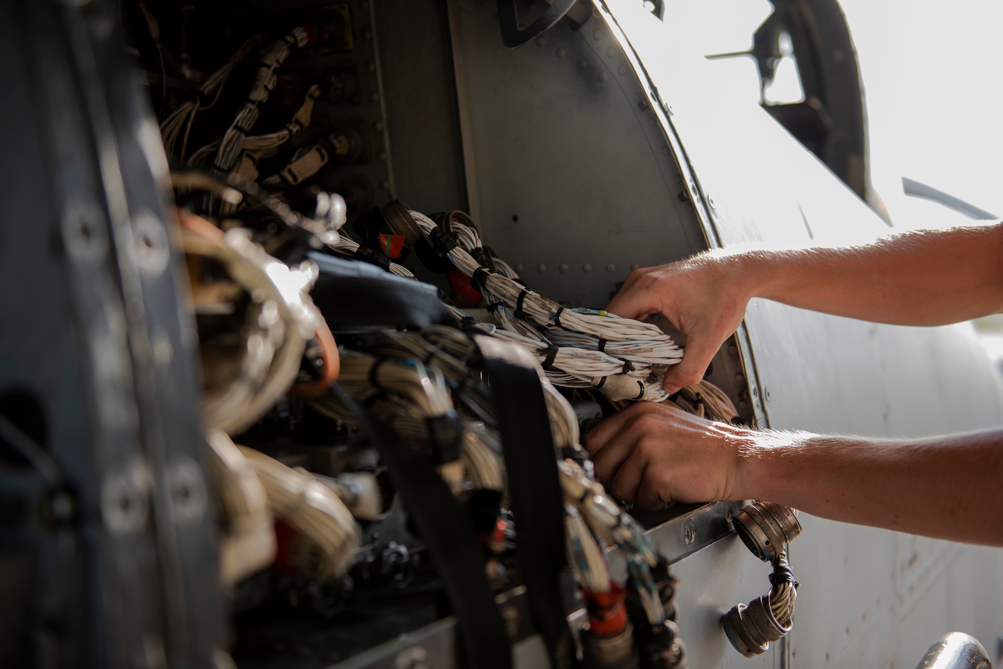 Airman 1st Class Tanner Giroux, 75th Aircraft Maintenance Unit (AMU) avionics technician, works on the wiring of an A-10C Thunderbolt II, Aug. 8, 2019, at Moody Air Force Base, Ga. The 75th AMU is responsible for the upkeep and maintenance of the Air Force’s largest operational A-10C Thunderbolt II fighter group. (U.S.  Air Force photo by 2nd Lt. Kaylin P. Hankerson)
