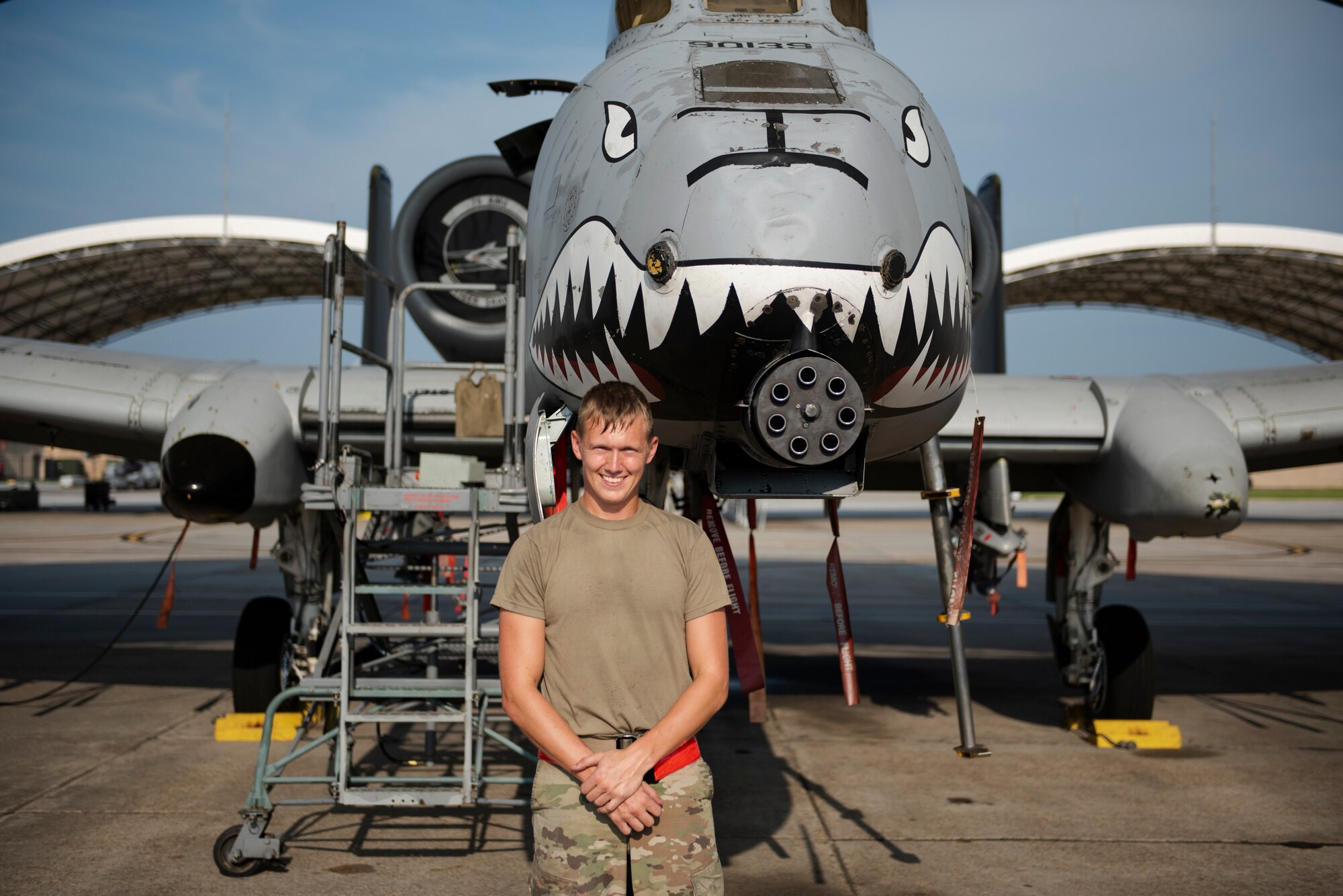 Airman 1st Class Tanner Giroux, 75th Aircraft Maintenance Unit (AMU) avionics technician, poses in front of an A-10C Thunderbolt II, Aug. 8, 2019, at Moody Air Force Base, Ga. The 75th AMU is responsible for the upkeep and maintenance of the Air Force’s largest operational A-10C Thunderbolt II fighter group. (U.S.  Air Force photo by 2nd Lt. Kaylin P. Hankerson)