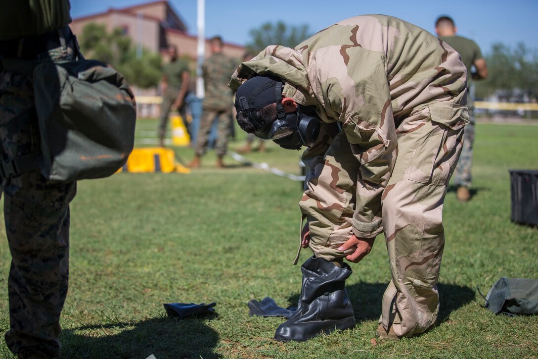 U.S. Marines stationed at Marine Coprs Air Station (MCAS) Yuma, recieve their training in order to become a squadron decontamination team at MCAS Yuma, Ariz., August 14, 2019. Each squadron is required to have a decontamination team that is trained quarterly by a Chemical, Biological, Radiological and Nuclear Defense Specialist. (U.S. Marine Corps photo by Lance Cpl. John Hall)