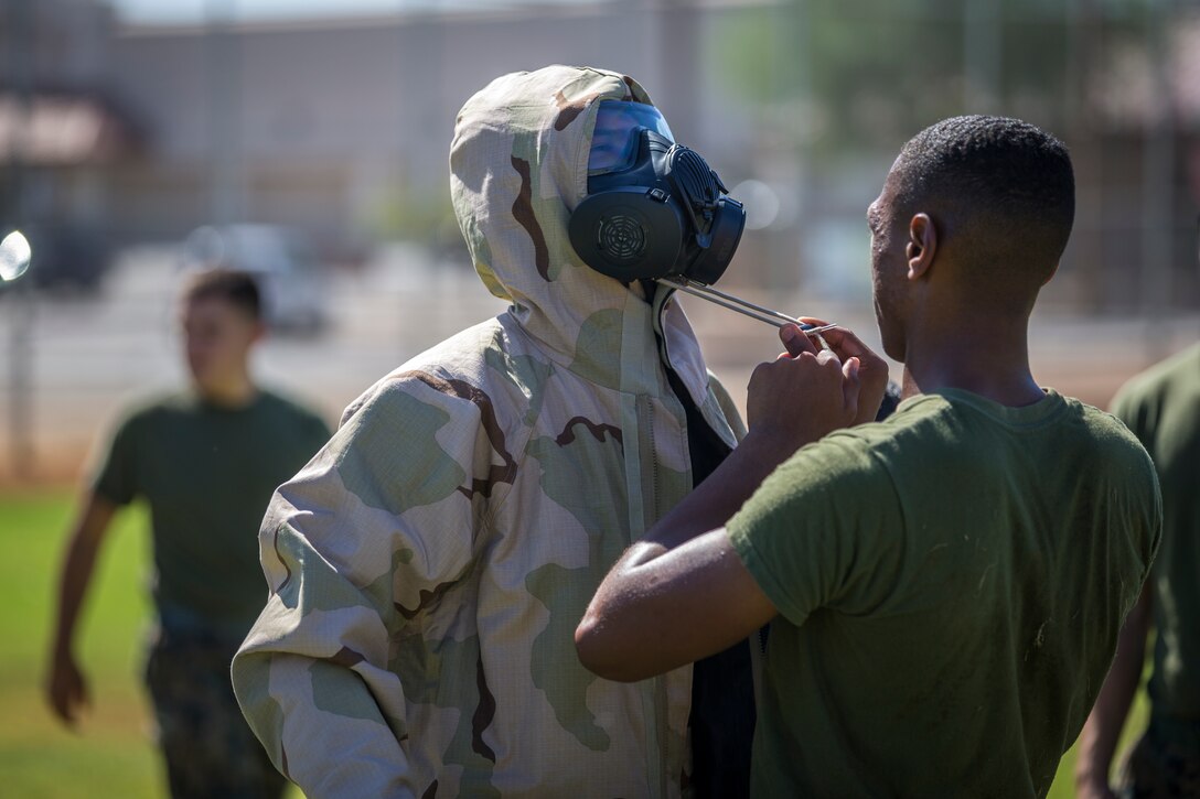 U.S. Marines stationed at Marine Coprs Air Station (MCAS) Yuma, recieve their training in order to become a squadron decontamination team at MCAS Yuma, Ariz., August 14, 2019. Each squadron is required to have a decontamination team that is trained quarterly by a Chemical, Biological, Radiological and Nuclear Defense Specialist. (U.S. Marine Corps photo by Lance Cpl. John Hall)