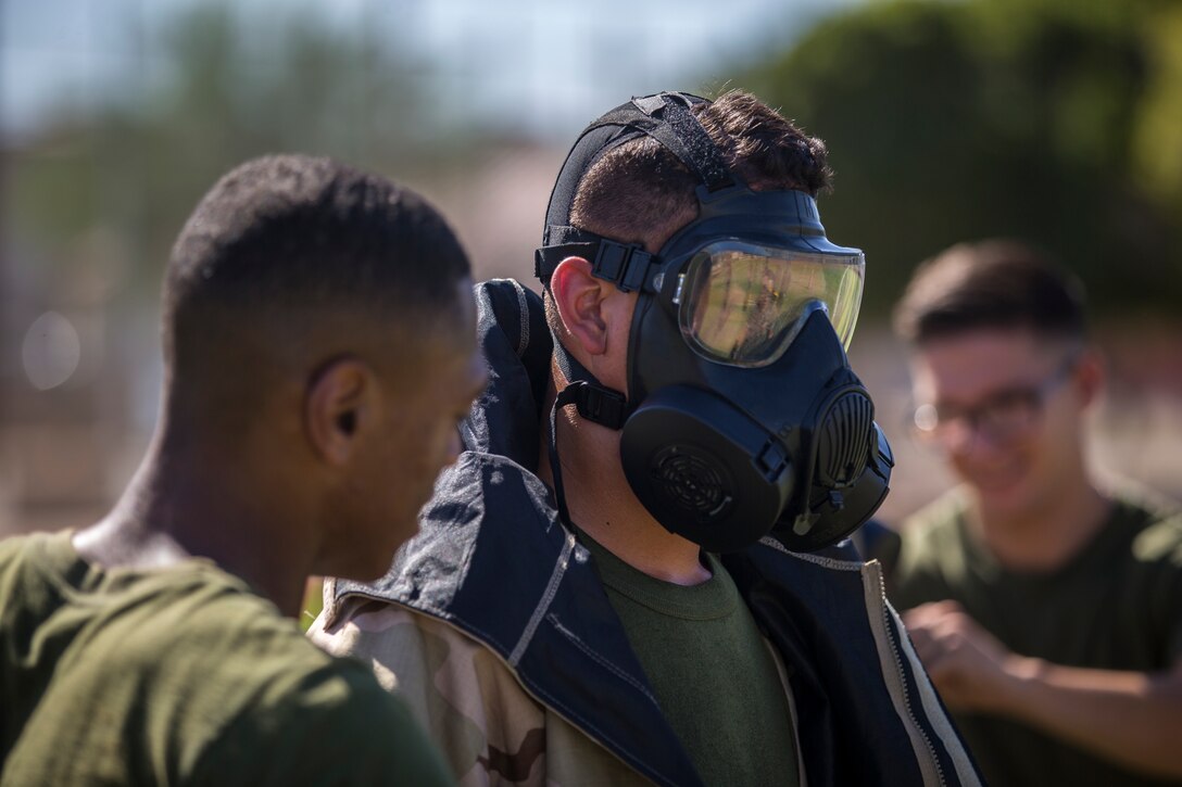 U.S. Marines stationed at Marine Coprs Air Station (MCAS) Yuma, recieve their training in order to become a squadron decontamination team at MCAS Yuma, Ariz., August 14, 2019. Each squadron is required to have a decontamination team that is trained quarterly by a Chemical, Biological, Radiological and Nuclear Defense Specialist. (U.S. Marine Corps photo by Lance Cpl. John Hall)