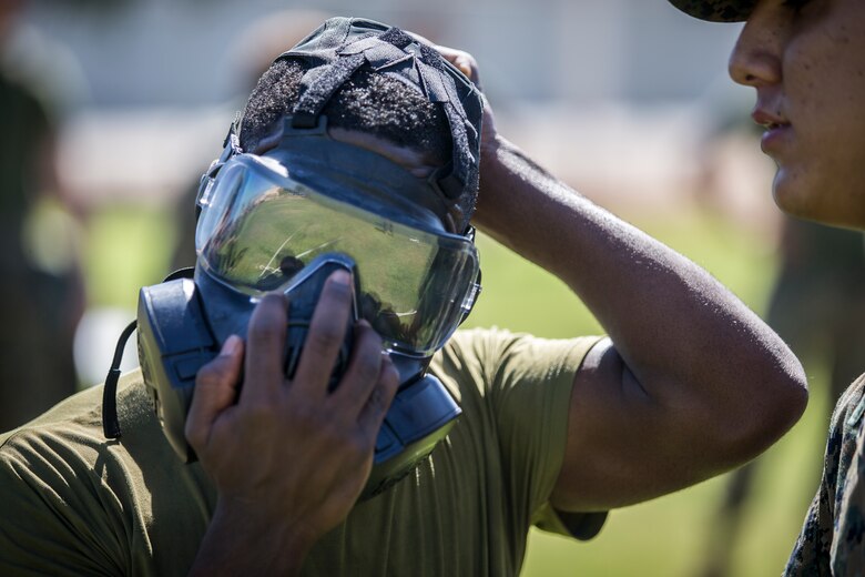 U.S. Marines stationed at Marine Coprs Air Station (MCAS) Yuma, recieve their training in order to become a squadron decontamination team at MCAS Yuma, Ariz., August 14, 2019. Each squadron is required to have a decontamination team that is trained quarterly by a Chemical, Biological, Radiological and Nuclear Defense Specialist. (U.S. Marine Corps photo by Lance Cpl. John Hall)