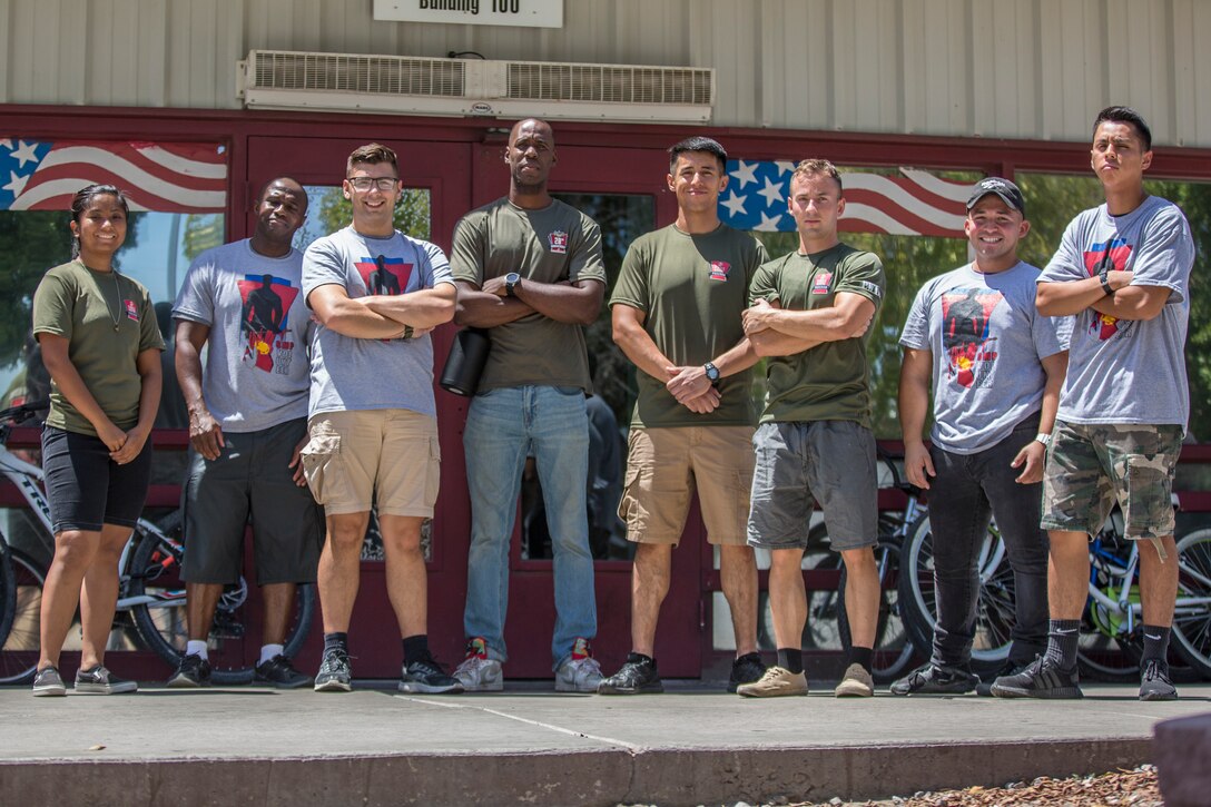 U.S. Marines stationed at Marine Corps Air Station (MCAS) Yuma, participate in the MCAS Yuma Single Marine Program's (SMP) volunteer event at the Crossroads Mission in Yuma, Ariz., August 10, 2019. The Marines served food, cleaned, and prepared food for the mission. (U.S. Marine Corps photo by Cpl. Sabrina Candiaflores)