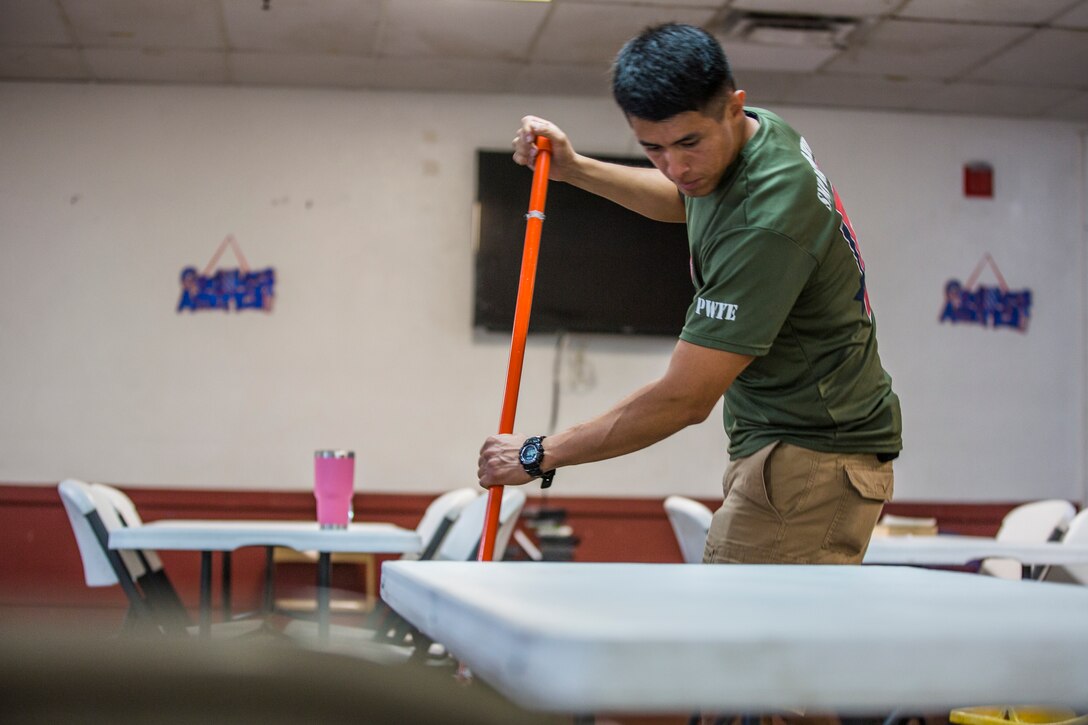 U.S. Marines stationed at Marine Corps Air Station (MCAS) Yuma, participate in the MCAS Yuma Single Marine Program's (SMP) volunteer event at the Crossroads Mission in Yuma, Ariz., August 10, 2019. The Marines served food, cleaned, and prepared food for the mission. (U.S. Marine Corps photo by Cpl. Sabrina Candiaflores)