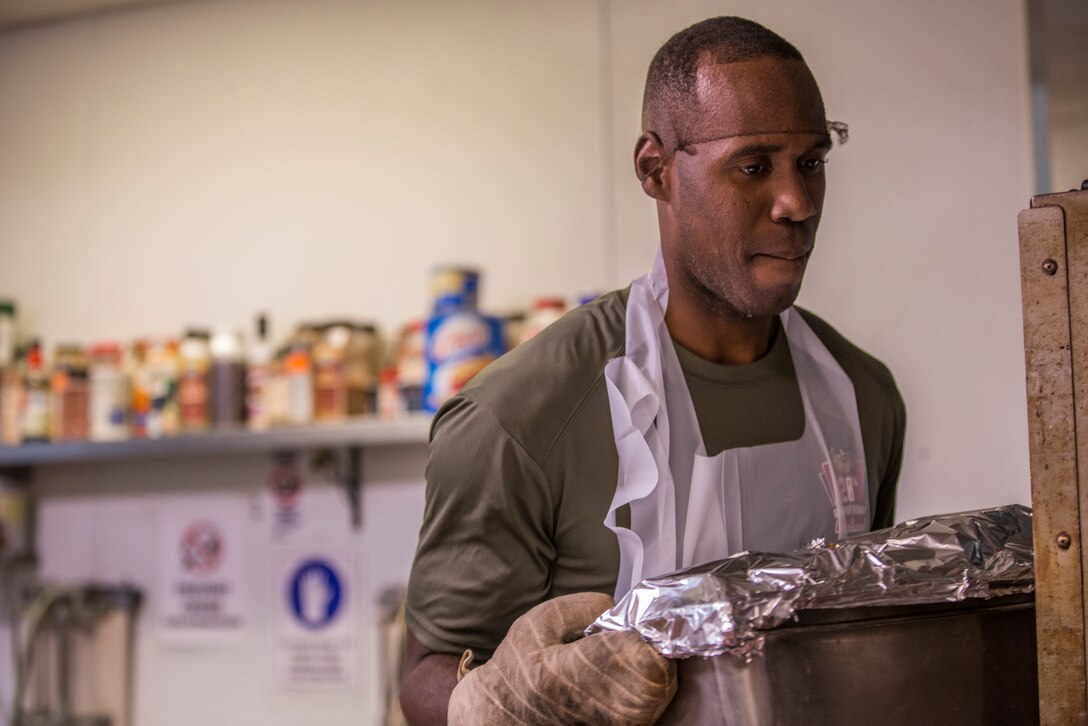 U.S. Marines stationed at Marine Corps Air Station (MCAS) Yuma, participate in the MCAS Yuma Single Marine Program's (SMP) volunteer event at the Crossroads Mission in Yuma, Ariz., August 10, 2019. The Marines served food, cleaned, and prepared food for the mission. (U.S. Marine Corps photo by Cpl. Sabrina Candiaflores)