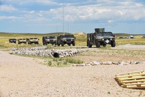 90th Mission Support Group preforms in a tactical convoy exercise during a warrior day Aug. 15, 2019, on F.E. Warren Air Force Base, Wyo. 90th MSG Airmen participated in a hands-on Self Aid Buddy Care training, vehicle familiarization, and tactical convoy and communications. (U.S. Air Force photo by Senior Airman Abbigayle Williams)