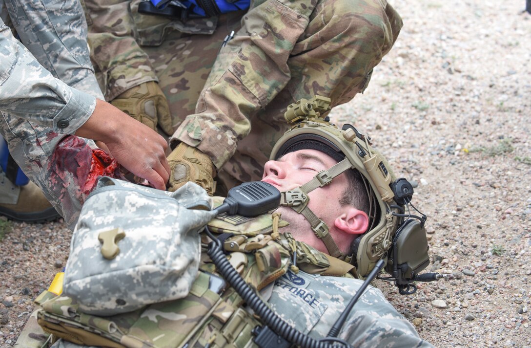 Airmen practice Self Aid Buddy Care techniques during a simulated convoy as part of the 90th Mission Support Group's Warrior Day on F.E. Warren Air Force Base, Wyo., Aug. 15, 2019. As part of the event, Airmen went through a refresher SABC course, along with convoy operations briefs and walkthroughs. (U.S. Air Force photo by Senior Airman Abbigayle Williams)