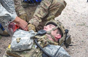 Airmen practice Self Aid Buddy Care techniques during a simulated convoy as part of the 90th Mission Support Group's Warrior Day on F.E. Warren Air Force Base, Wyo., Aug. 15, 2019. As part of the event, Airmen went through a refresher SABC course, along with convoy operations briefs and walkthroughs. (U.S. Air Force photo by Senior Airman Abbigayle Williams)