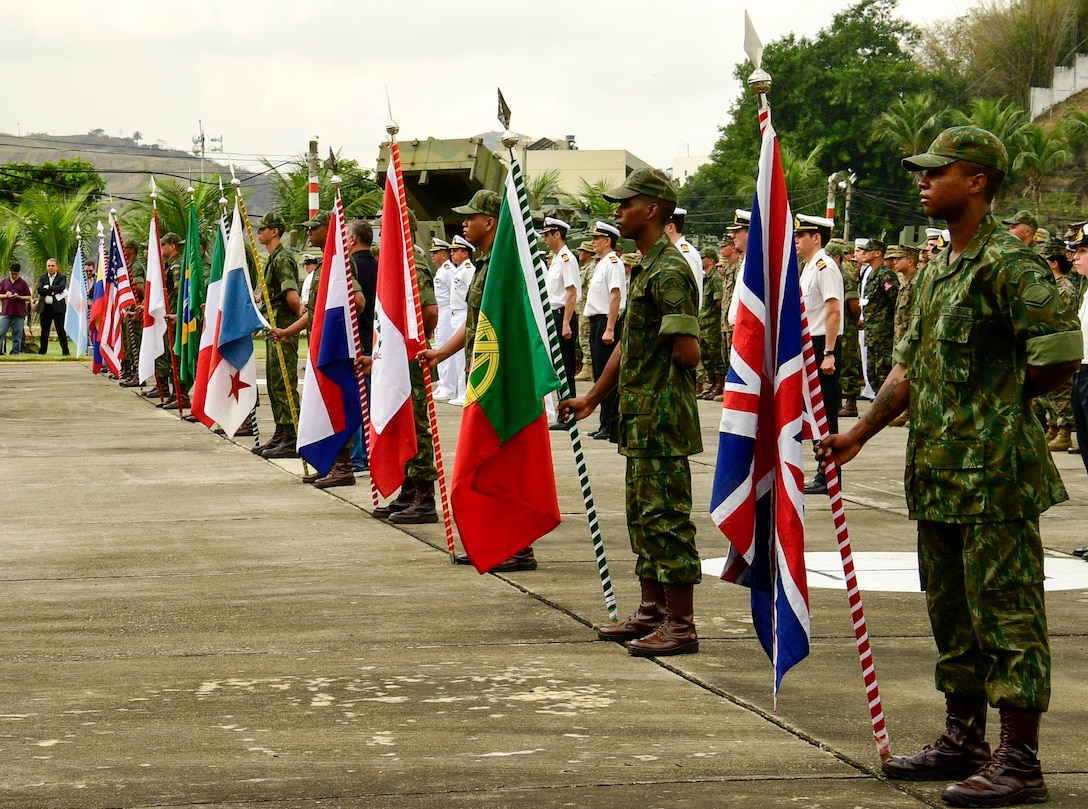 Military members from 13 countries stand in formation.
