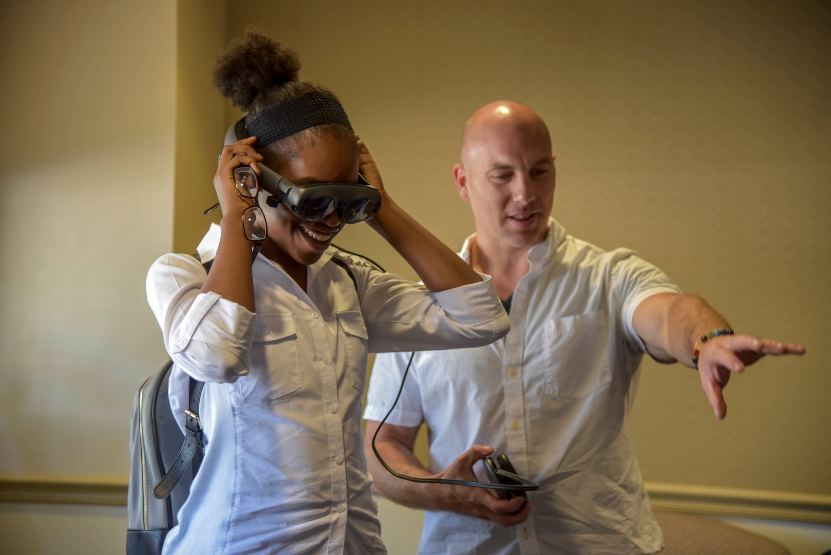 PHILADELPHIA (August 15, 2019) Naval Surface Warfare Center, Philadelphia Division (NSWCPD) engineer Patrick Violante demonstrates augmented reality to a Girl Scout summer camper during the Girl Scouts of Eastern Pennsylvania for their STEM Experience Summer Camp on Aug. 15. Violante works with the Command’s Advanced Data Acquisition, Prototyping Technologies and Virtual Environments lab, which focuses on cutting-edge 3-D modeling, scanning, and printing. (U.S. Navy photo by Kirsten St. Peter/Released)