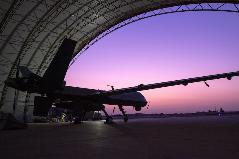 An aircraft sits in a hangar.
