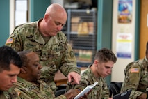 Photo of Sgt. 1st Class Thomas Flannery instructing a class.