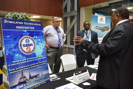 Washington, DC (August 13, 2019) -- (L) Jim Toretti and (C) Jason McDaniel from NAVSEA's Small Business Innovation Research (SBIR) speaks at the Small Business Industry Day which was held in the Humphreys auditorium and cafe atrium.