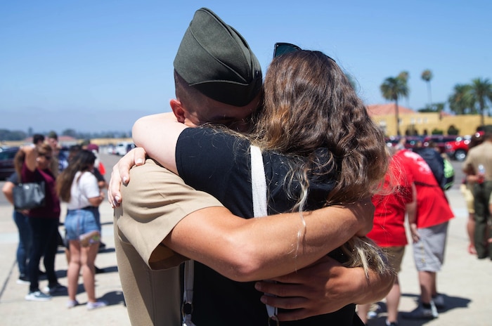 A Marine from Delta Company, 1st Recruit Training Battalion, hugs his loved one after being released for liberty at Marine Corps Recruit Depot, August 15.