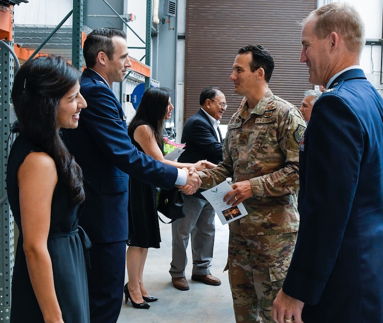 AEDC Aeropropulsion Combined Test Force Director Lt. Col. Lane Haubelt, center left, meets AEDC Commander Col. Jeffrey Geraghty after the Aeropropulsion CTF Change of Leadership Ceremony at the Sea Level 2 Test Cell at Arnold Air Force Base. Also pictured, Haubelt's wife, Marina, left, and Test Operations Division Chief Col. Keith Roessig. (U.S. Air Force photo by Jill Pickett)