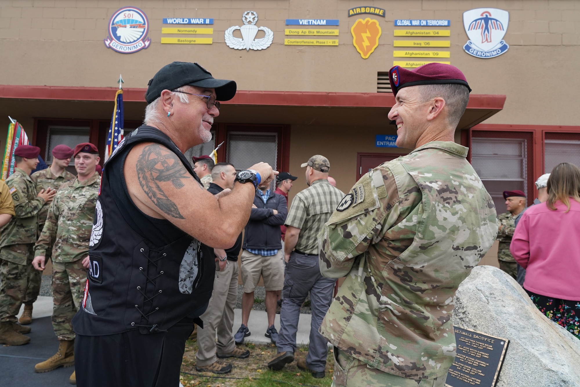 Retired Army 1st Sgt. Lee “Scrounger” Cromwell, of Pinehurst, NC, left, talks with Army Lt. Col. Matt Myer, the commander of 1st Battalion, 501st Parachute Infantry Regiment, 4th Infantry Brigade Combat Team (Airborne), 25th Infantry Division, U.S. Army Alaska, as active-duty paratroopers, veterans of the unit, dependents, and honored guests gather for 'Geronimo Week' festivities on Joint Base Elmendorf-Richardson, Alaska, Aug. 14, 2019, celebrating the unit's lineage. The regiment was activated on Nov. 15, 1942, at Camp Toccoa, Ga., served with distinction in World War II, the Cold War, Vietnam, as well as the Global War on Terror and continues to uphold the high standards expected of an airborne unit in peacetime duties and on the field of battle.