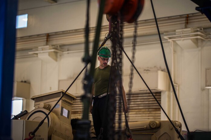 U.S. Marine Corps Cpl. Mike Sharretto performs corrective maintenance on a tactical vehicle on Camp Kinser, Okinawa, Japan, August 16, 2019. Corrective maintenance is done regularly to ensure proper vehicle functionality. Sharretto, a native of Wallingford, Connecticut is a motor transportation technician with Motor Transport Maintenance Company, 3rd Maintenance Battalion, 3rd Marine Logistics Group. (U.S. Marine Corps photo by Lance Cpl. Isaiah Campbell)