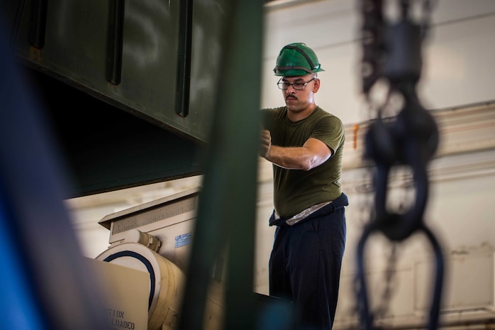 U.S. Marine Corps Cpl. Mike Sharretto performs corrective maintenance on a tactical vehicle on Camp Kinser, Okinawa, Japan, August 16, 2019. Corrective maintenance is done regularly to ensure proper vehicle functionality. Sharretto, a native of Wallingford, Connecticut, is a motor transportation technician with Motor Transport Maintenance Company, 3rd Maintenance Battalion, 3rd Marine Logistics Group. (U.S. Marine Corps photo by Lance Cpl. Isaiah Campbell)