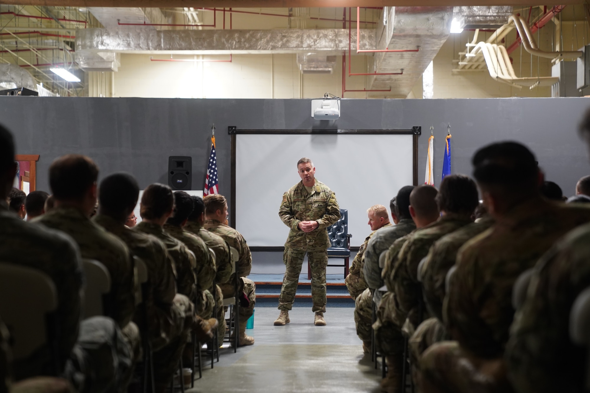 Chief Master Sgt. Christian Hendrick addresses the enlisted members of the 353rd Special Operations Group at an all call on 14 August, 2019.