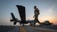 Maintainers with the 386th Expeditionary Aircraft Maintenance Squadron tow a U.S. Air Force MQ-9 Reaper remotely piloted aircraft into position for an engine test prior to Intelligence, Surveillance, and Reconnaissance operations at Ali Al Salem Air Base, Kuwait, July 23, 2019. Reaper’s are maintained, launched and recovered from deployed locations, but are remotely operated from bases in the United States during ISR operations around the world. (U.S. Air Force Photo by Tech. Sgt. Michael Mason, tail number obscured for operational security)