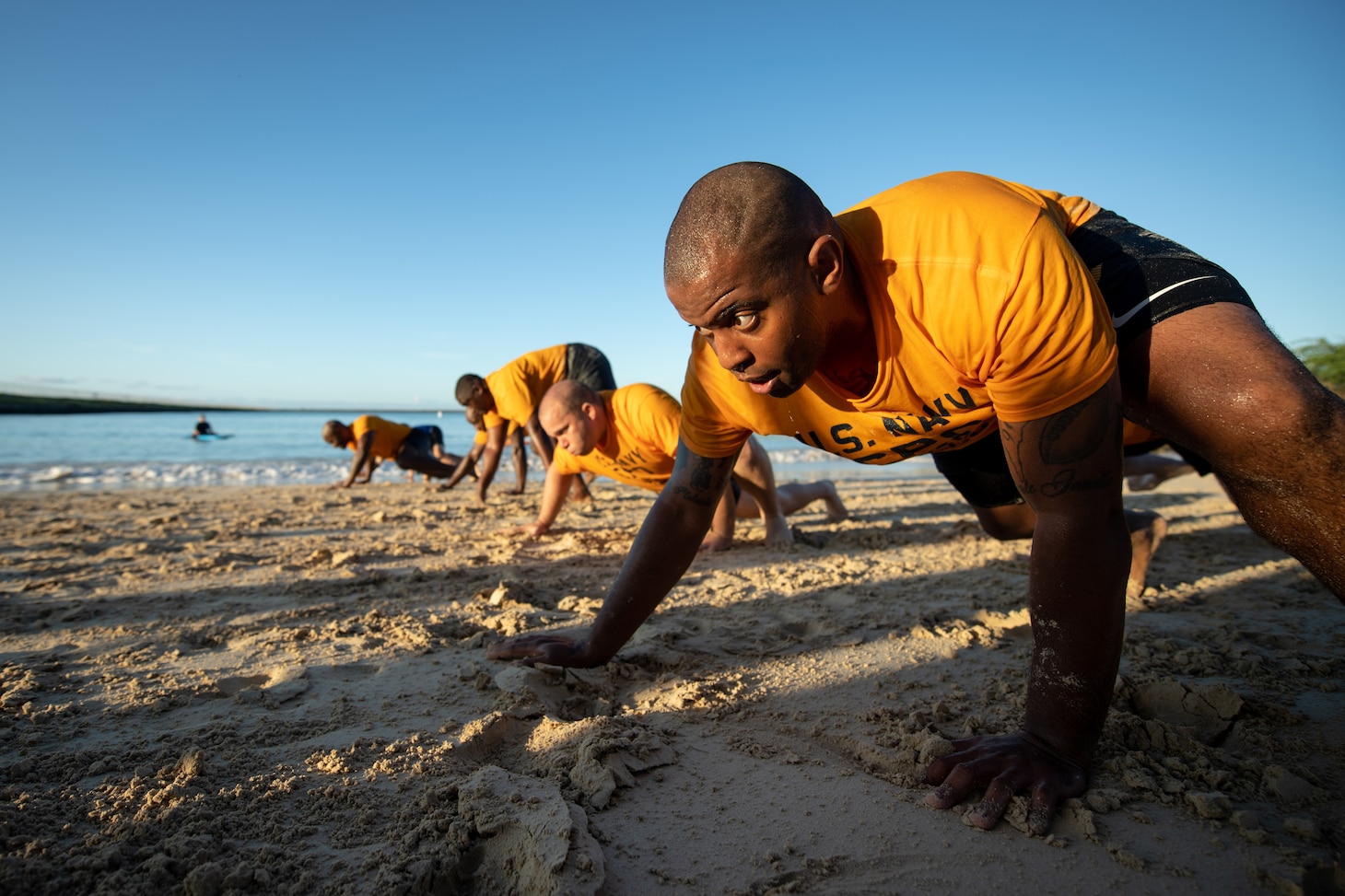 A chief selectee does a push up.