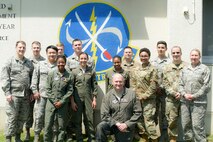 The U.S. Air Force 610th Air Control Flight pauses for a group photo at Misawa Air Base, Japan, July 31, 2019. The 610th ACF won two Headquarters Air Force-level awards in 2018 including the “Outstanding Ground-Based Battle Management Command and Control Crew.” Its mission ensured airspace safety for F-16 Fighting Falcon sorties by de-conflicting with multiple aircraft and providing pilots real-time feedback.