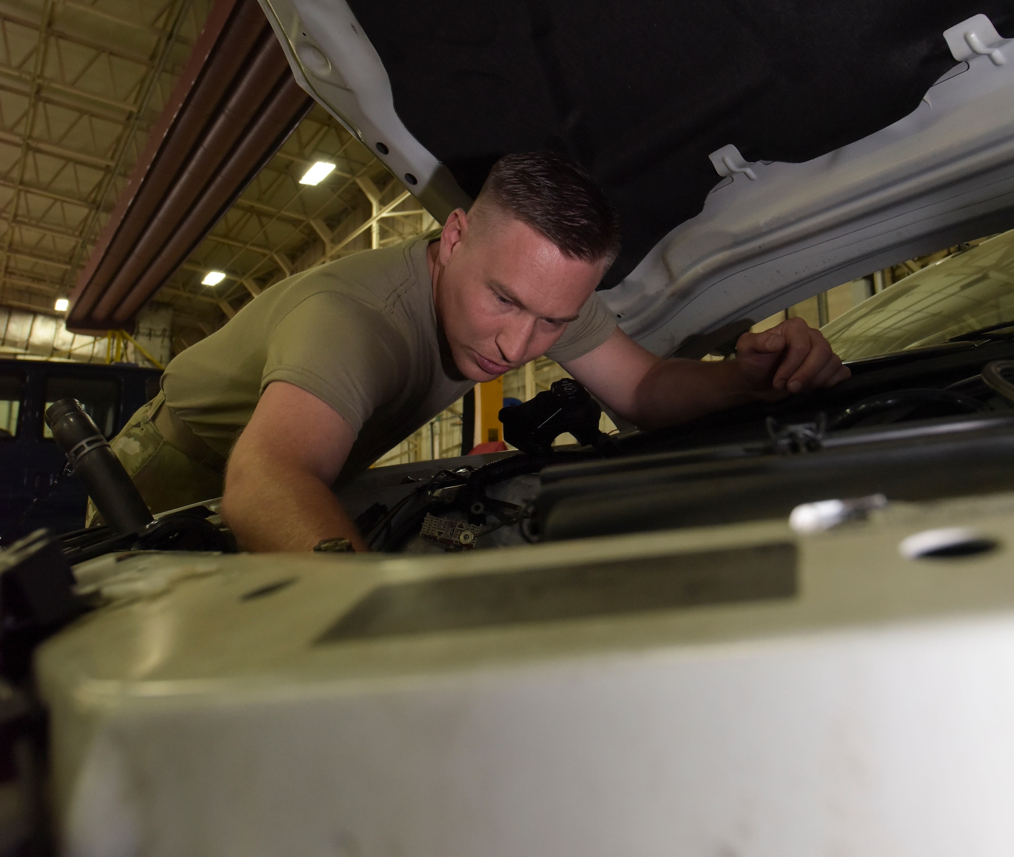 136th Logistics Readiness Squadron, Texas Air National Guardsmen Tech. Sgt. Andrew Merrill, fire truck and refueler maintainer, works on a 100 LRS assigned vehicle at RAF Mildenhall, England, July 30, 2019. Some of these guardsmen are full-time at their home station at Naval Air Station Joint Reserve Base Fort Worth, Texas, and are able to bring new skill sets here. (U.S. Air Force photo by Senior Airman Alexandria Lee)
