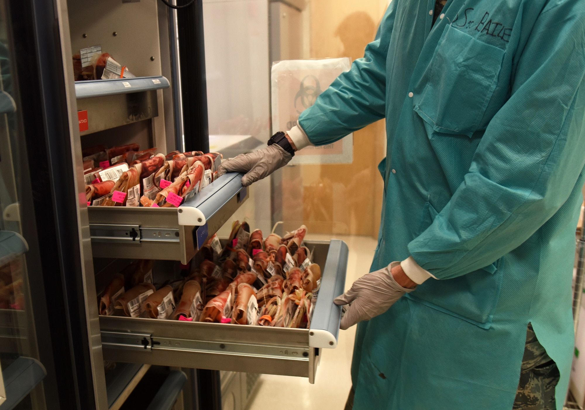 A 48th Medical Support Squadron laboratory technician checks blood units at Royal Air Force Lakenheath, England, Aug.14, 2019. Laboratory technicians provide accurate medical tests and appropriately diagnose illnesses to ensure the readiness of Liberty Wing Airmen. (U.S. Air Force photo by Airman 1st Class Madeline Herzog)