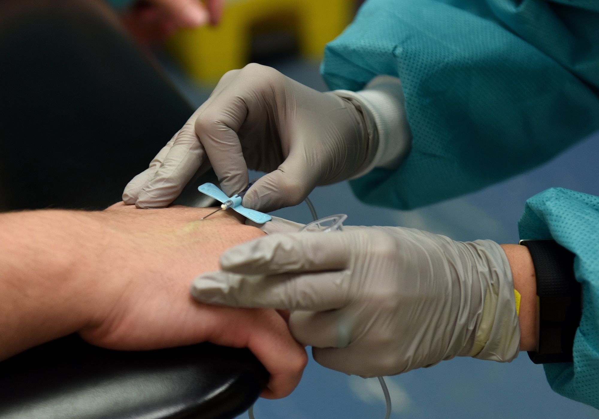 A 48th Medical Support Squadron laboratory technician draws an Airman’s blood at Royal Air Force Lakenheath, England, Aug.14, 2019. Laboratory technicians at the 48th Fighter Wing have an integral role in providing Airmen and their family members with a proper diagnosis and treatment to support the readiness mission. (U.S. Air Force photo by Airman 1st Class Madeline Herzog)