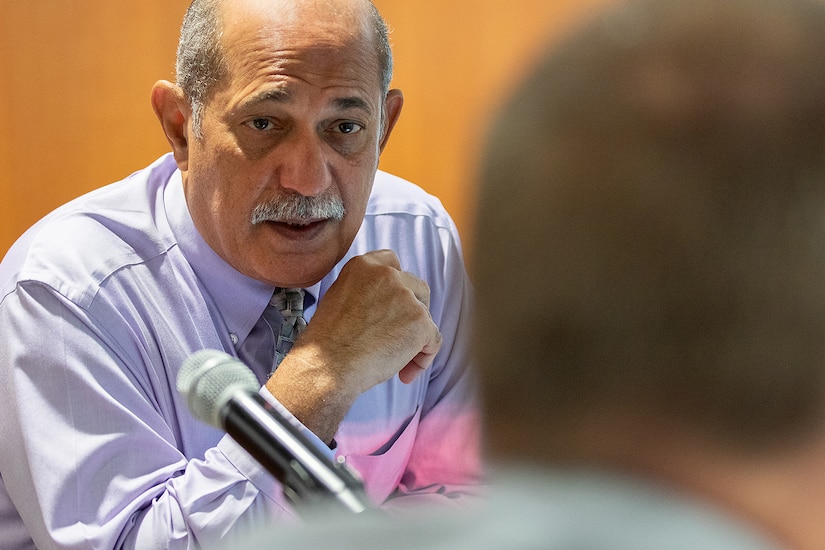 Juan De Jesus, U.S. Army Financial Management Command electronic commerce director, talks about what the Army is doing to prepare to consolidate current Department of Defense stored value cards in to a single card that would be industry compliant, improve security and leverage cost savings through economies of scale during a meeting at the Federal Reserve Bank of Boston May 8, 2019. Army, Navy, Air Force and Marine Corps representatives, along with their U.S. Treasury’s Bureau of the Fiscal Service and Federal Reserve Bank counterparts have been meeting quarterly to discuss the consolidation, with software and hardware capable of handling both the current cards and the new-EagleCash deployed around the globe this fall. (U.S. Army photo by Mark R. W. Orders-Woempner)