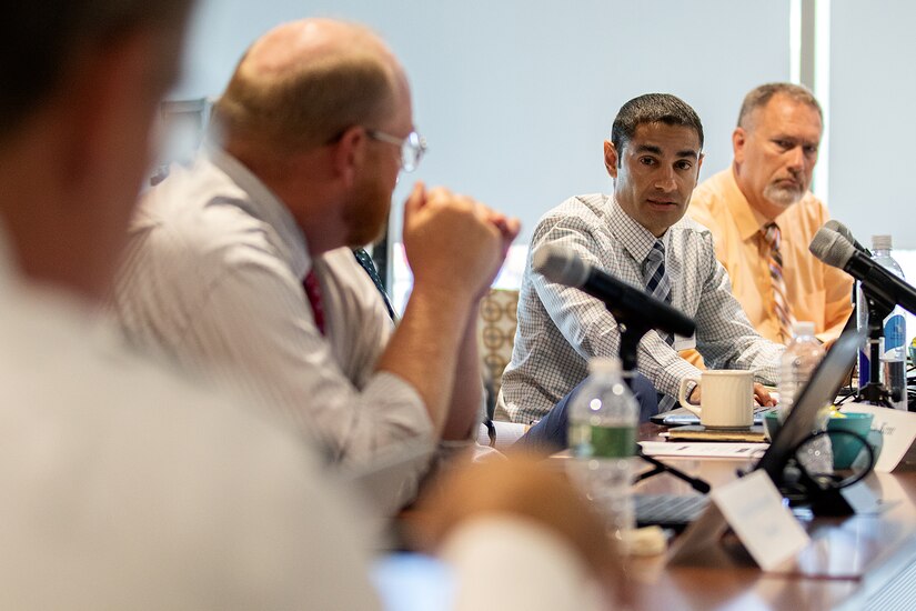 Nadir Isfahani, U.S. Treasury’s Bureau of the Fiscal Service stored value cards portfolio manager, second from right, answers a question from Tony Taylor, U.S. Army Financial Management Command EagleCash program manager, far left, as they discuss a plan to merge Army, Marine Corps, Navy and Air Force SVCs into one single card, an EagleCash consolidated card, during a meeting at the Federal Reserve Bank of Boston Aug. 8, 2019. Currently, the Department of Defense uses non-reloadable EZpay cards to optimize training time at initial entry training sites and reloadable EagleCash and Navy Cash cards for deployed personnel to save money and increase security. (U.S. Army photo by Mark R. W. Orders-Woempner)