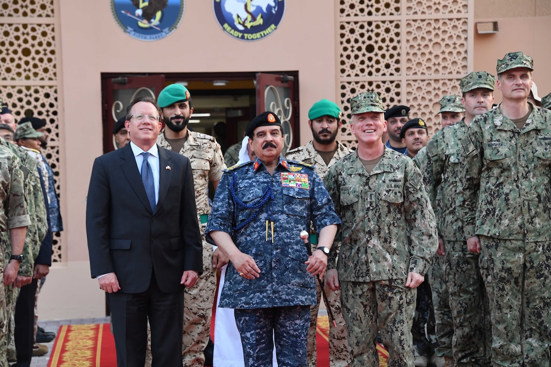 His Majesty, King Hamad bin Isa Al Khalifa, the King of the Kingdom of Bahrain, center, Vice Adm. Jim Malloy, commander of U.S. Naval Forces Central Command, U.S. 5th Fleet, right, and the U.S. Ambassador to the Kingdom of Bahrain, the honorable Justin Siberell, pose for a photo during a visit to discuss operations in the U.S. 5th Fleet area of operations. The King was accompanied by two of his sons, His Highness Maj. Gen. Shaikh Nasser bin Hamad Al-Khalifa, commander of the Bahraini Royal Guard, and His Highness Lt. Col. Shaikh Khaled bin Hamad Al Khalifa, commander of the Bahraini Royal Guard Rapid Intervention Force along with other top Bahraini military leaders. Bahrain has been a partner with the United States in regional maritime security for more than 70 years. (U.S. Navy photo by Mass Communication Specialist 3rd Class Dawson Roth/Released)