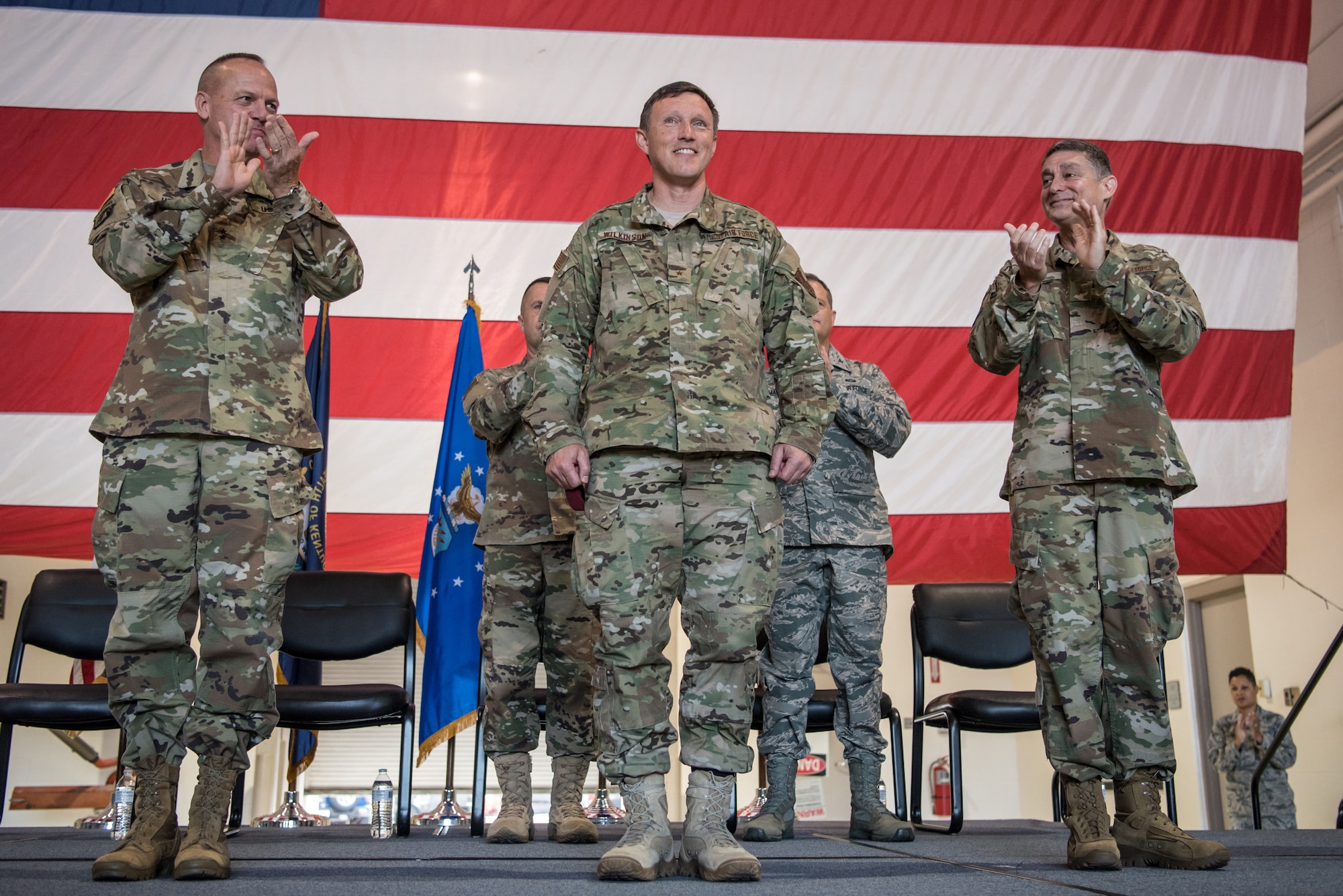 Brig. Gen. Jeffrey Wilkinson (center) assumes responsibility as Kentucky’s next assistant adjutant general for Air during a ceremony at the Kentucky Air National Guard Base in Louisville, Ky., Aug. 11, 2019. Wilkinson replaces Brig. Gen. Warren Hurst, who held the post for six years. (U.S. Air National Guard photo by Staff Sgt. Joshua Horton)