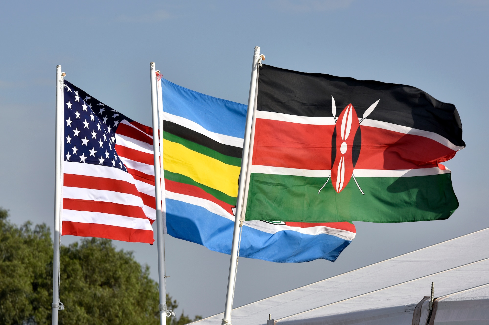 Flags from the U.S., African community, and Kenya are posted for the African Partnership Flight Kenya 2019 at Laikipia Air Base, Kenya, August 20, 2019.