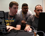 Cyber warfare operators set up their computer stations before a capture-the-flag competition during DEF CON 27 Hacking Conference in Las Vegas Aug. 8. The operators participated in a number of DEF CON events to showcase their knowledge and experience.