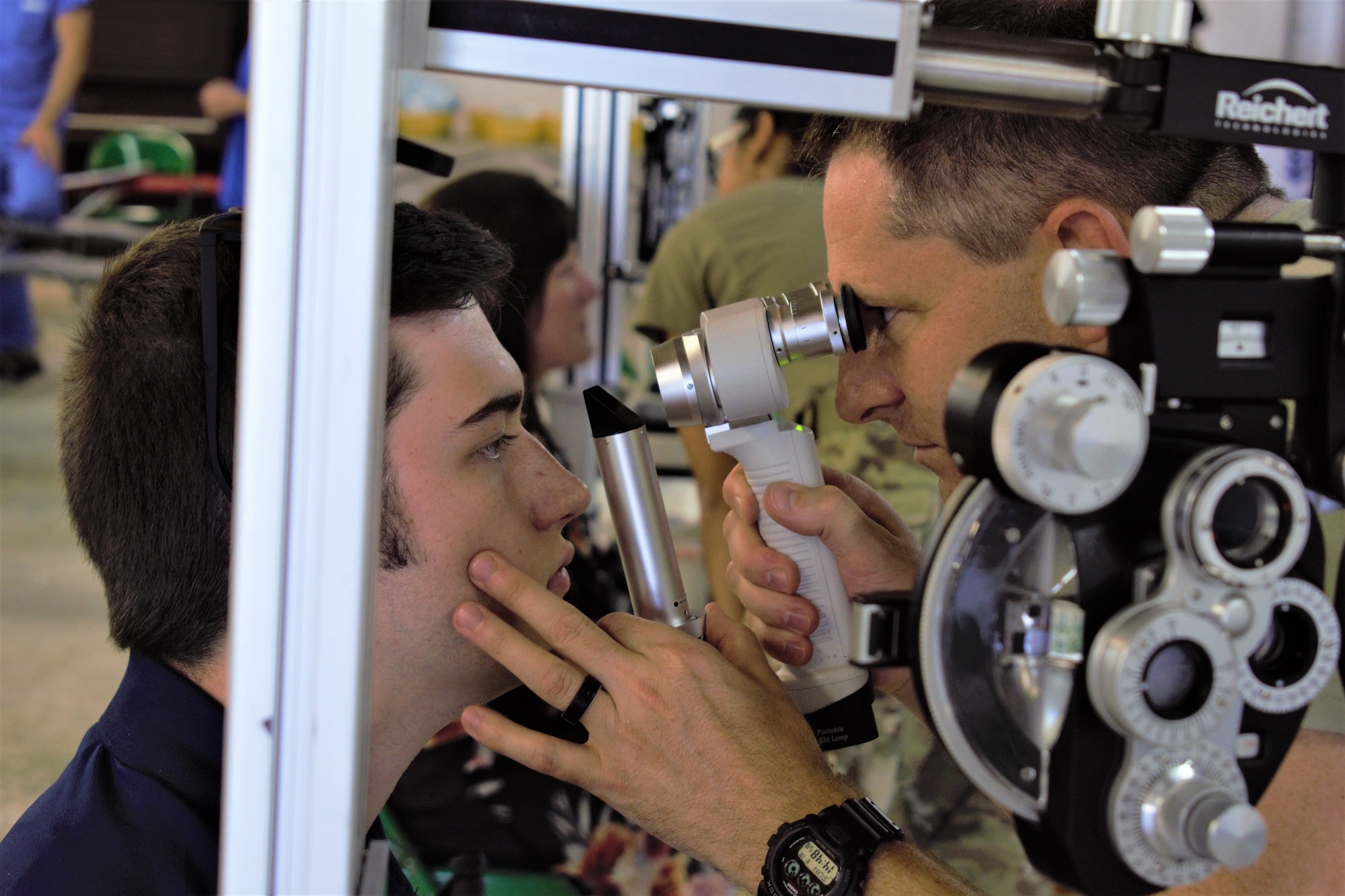 Maj. Joshua Metzger, optometrist, 127th Medical Group, Selfridge Air National Guard Base, Mich., examines a patient during Innovative Readiness Training Appalachian Care 2019 at Wise County Fairgrounds, Wise, Va., Aug. 18, 2019. Appalachian Care Innovative Readiness Training 2019 takes place Aug. 16-29, 2019, to care for the medically underserved communities of Wise, Virginia while simultaneously conducting deployment and readiness training for military personnel. Innovative Readiness Training is the only hands-on training opportunity authorized to operate within the U.S. During Appalachian Care IRT 2019, medical operations will be staged at one physical location at Wise County Fairgrounds. The Appalachian Care IRT 2019 team provides medical, dental, optometry and veterinary care to assist local health and municipal authorities in addressing underserved and unmet community health and civic needs. Units also conduct critical mission training and logistical movement in order to simulate hands-on deployment readiness operations and health care delivery in the time of crisis, conflict or disaster. (Air National Guard photo by 1st Lt. Andrew Layton)