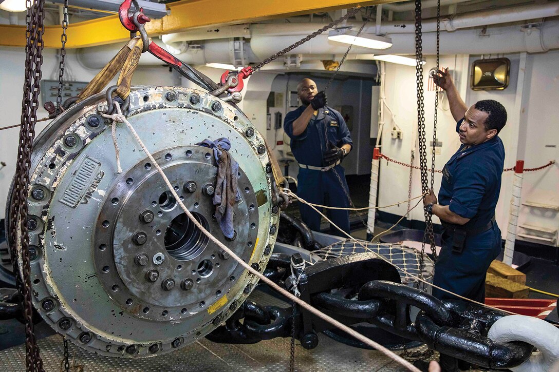 USN Sailors conduct maintenance on a Nigerian navy patrol boat