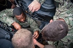 USN Sailors conduct maintenance on a Nigerian navy patrol boat