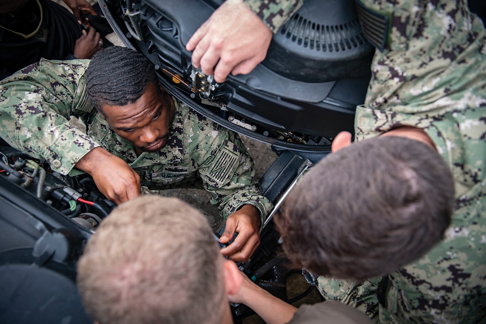 USN Sailors conduct maintenance on a Nigerian navy patrol boat