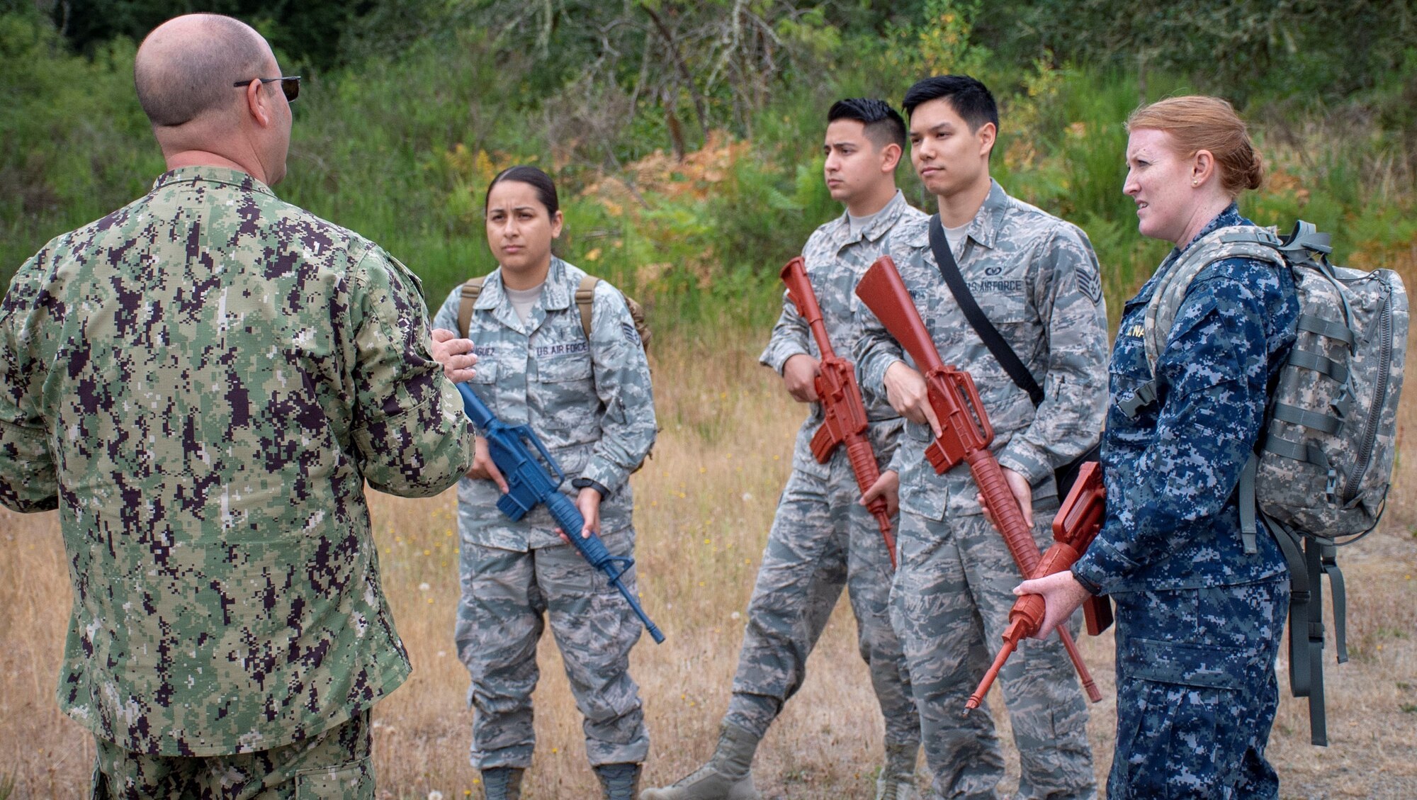 Safety first...participants are given a safety brief before a tactical combat casualty care (TCCC) class for exercise Tropic Halo 2019 at Joint Base Lewis-McChord in Tacoma, Wash., Aug. 7, 2019. Tropic Halo is designed to enhance Operational Hospital Support Unit Bremerton's medical and mission capabilities on several levels: increase TCCC and trauma nurse core course readiness rates while minimizing overall training costs; promote intra-service cohesion with collaborative training in a joint service environment and leverage Navy and Air Force command assets to generate better training opportunities. (U.S. Navy photo by Mass Communication Specialist 1st Class Ryan Riley)